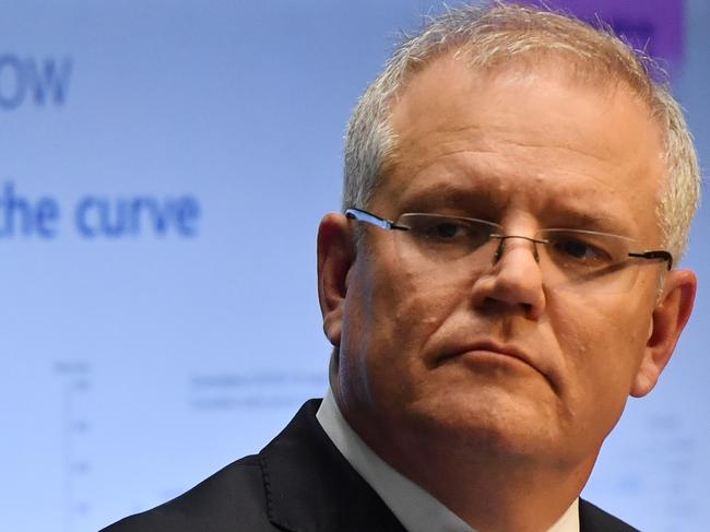 CANBERRA, AUSTRALIA - APRIL 07: Prime Minister Scott Morrison during a press conference in the Main Committee Room at Parliament House on April 07, 2020 in Canberra, Australia. Public gatherings are now limited to two people, while Australians are being urged to stay home unless absolutely necessary in a bid to reduce the spread of COVID-19. New South Wales and Victoria have also enacted additional lockdown measures to allow police the power to fine people who breach the two-person outdoor gathering limit or leave their homes without a reasonable excuse. Queensland, Western Australia, South Australia, Tasmania and the Northern Territory have all closed their borders to non-essential travellers and international arrivals into Australia are being sent to mandatory quarantine in hotels for 14 days. (Photo by Sam Mooy/Getty Images)