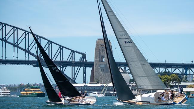 Two boats tact in front of Sydney Harbour Bridge. Picture: Thomas Lisson