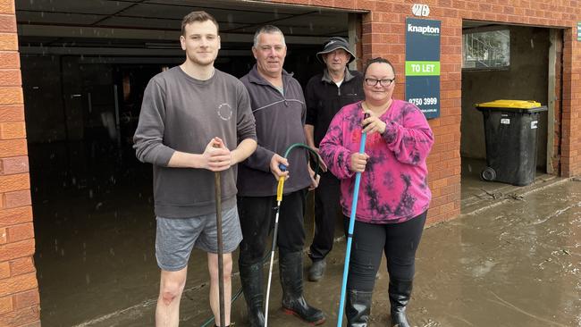 Mark Larkins, John Larkins, Syd Burton and Irena Ibrahim all share a building on Newbridge Road, and are pitching together to clean up their units for the third time in four months. Picture: Paul Brescia/NewsLocal