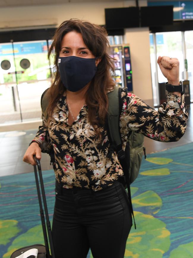 A relieved Korine Doumis at Darwin International Airport. Picture: Katrina Bridgeford