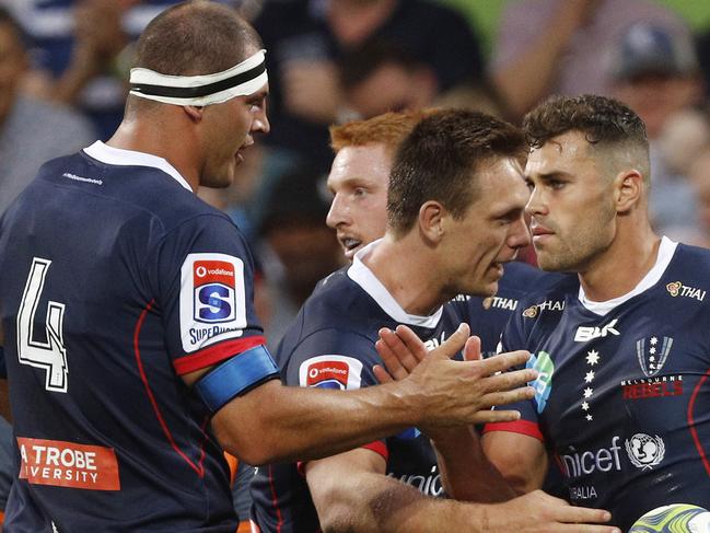 Tom English of the Rebels (right) celebrates a try during the Round 3 Super Rugby match between the Melbourne Rebels and the Highlanders at AAMI Park in Melbourne, Friday, March 1, 2019. (AAP Image/Daniel Pockett) NO ARCHIVING, EDITORIAL USE ONLY