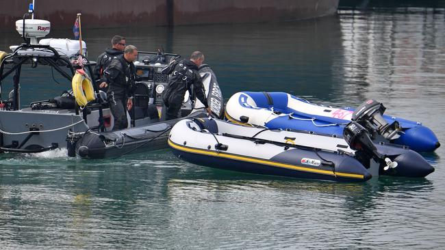 UK Border Force officers tow rigid inflatable boats used by migrants to cross the English Channel into the Marina in Dover. Picture: AFP