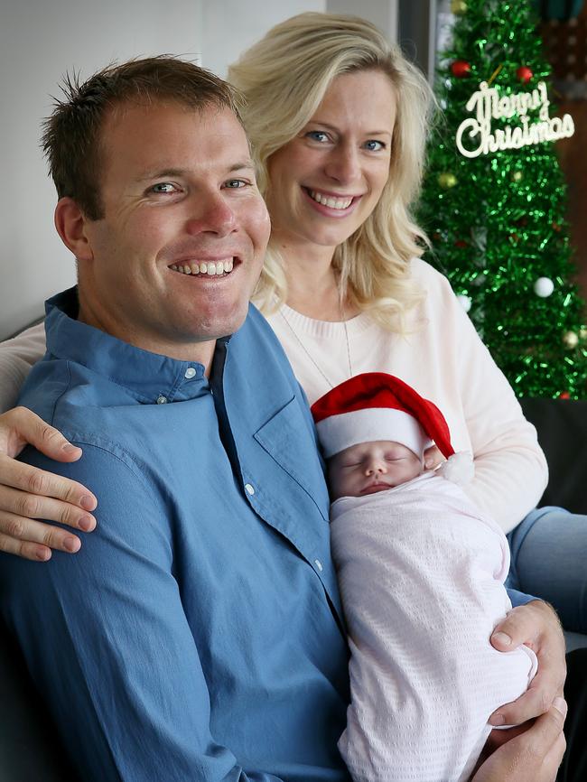 Rebecca White at home with her new baby Mia and partner Rod Dann in December. Picture: SAM ROSEWARNE