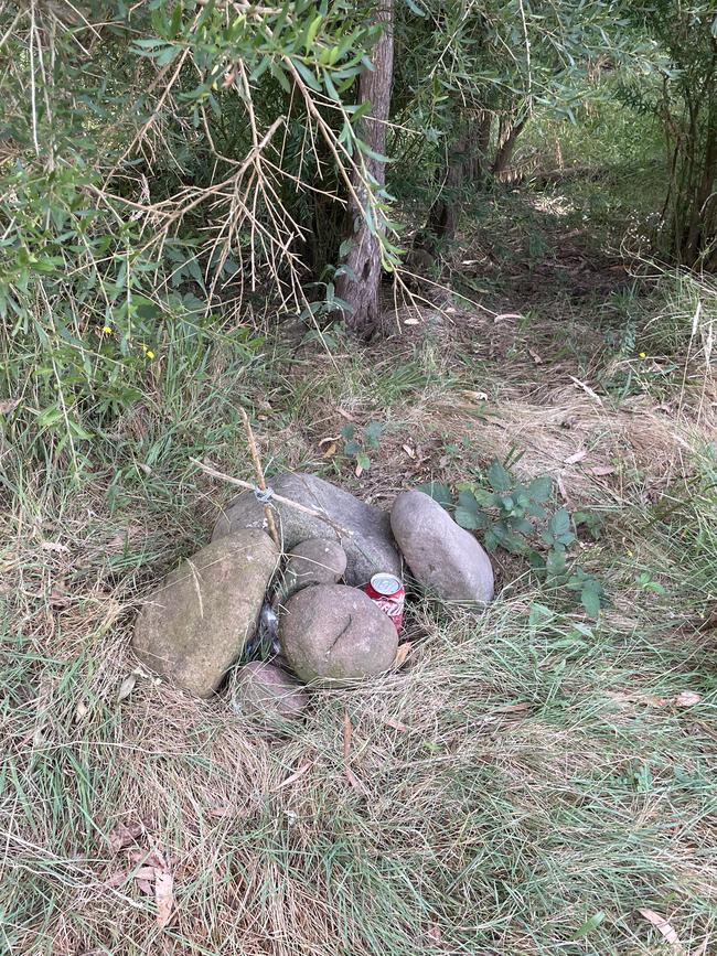 A small cairn of stones gathered by grieving friends and family members.