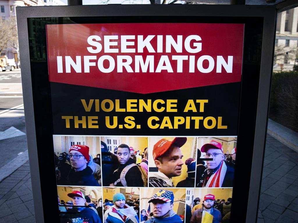 A billboard on a bus stop on Pennsylvania Ave Northwest advertises a message from the FBI seeking information related to violence at the Capitol. Picture: Al Drago/Getty Images/AFP