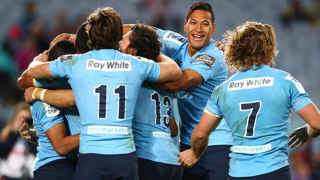 SYDNEY, AUSTRALIA - JUNE 28: The Waratahs celebrate a try by Bernard Foley during the round 17 Super Rugby match between the Waratahs and the Brumbies at ANZ Stadium on June 28, 2014 in Sydney, Australia. (Photo by Mark Nolan/Getty Images)