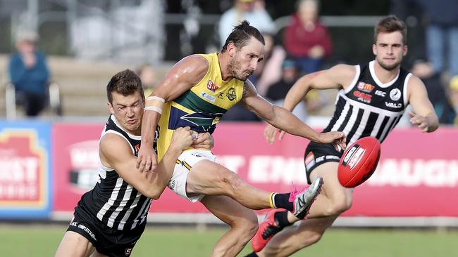 Woodville-West Torrens’ James Boyd gets his kick away against the Magpies.