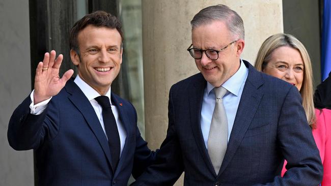 France's President Emmanuel Macron (left) waves as he welcomes Australia's Prime Minister Anthony Albanese to the presidential Elysee Palace in Paris in July. Picture: AFP