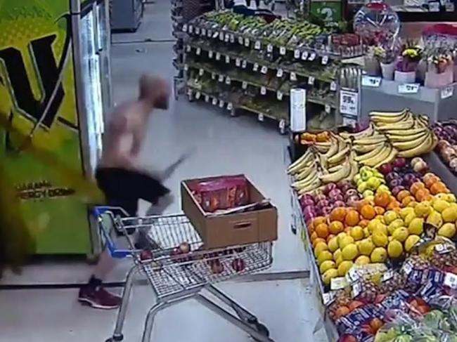 Dramatic CCTV vision shows a shirtless man chasing an alleged attempted shoplifter out of an Adelaide IGA with a machete., Picture: 9News