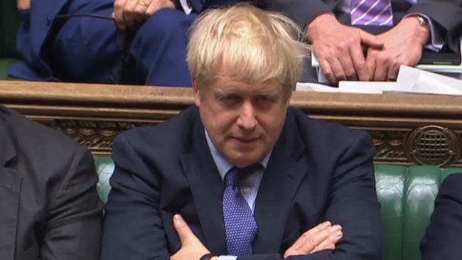 Prime Minister Boris Johnson reacting during the debate on the Brexit withdrawal agreement bill in the House of Commons in London this morning.