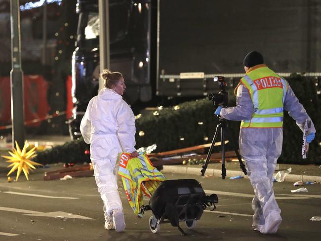 Forensic experts of the police investigate the crime scene after a truck ran into a crowded Christmas market and killed several people in Berlin, Germany on December 19, 2016. Picture: AP