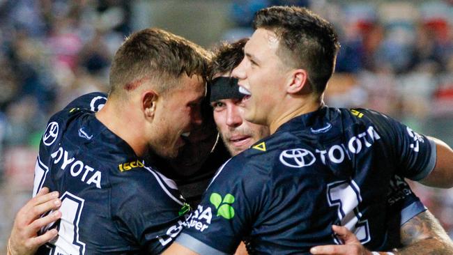 Kyle Feldt is congratulated after scoring for the Cowboys. Picture: AAP