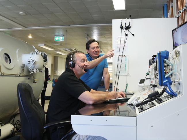 Hyperbaric facility manager Corry Van Den Broek (left) with co-clinical director Dr David Cooper. Picture: LUKE BOWDEN