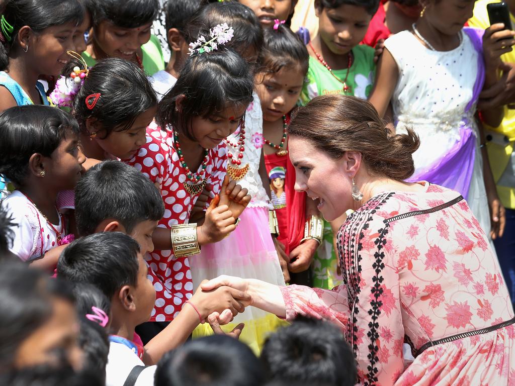 Catherine, Duchess of Cambridge shakes hands as she meets young children while visiting the Pan Bari agricultural village in Kaziranga National Park on day 4 of the royal visit to India and Bhutan on April 13, 2016 in Kaziranga, India. Picture: Getty