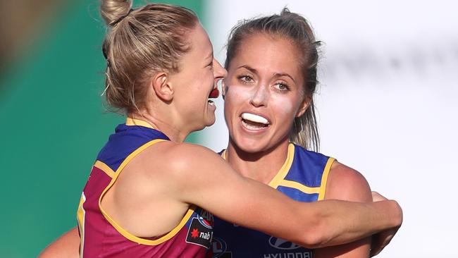 Kate McCarthy and Kaitlyn Ashmore celebrate a goal for the Lions. Picture: Darren England