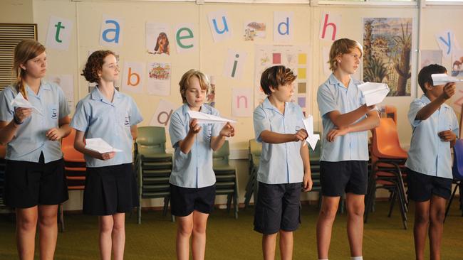 Faster ... Dylan  (Ed Oxenbould , third from left) has a talent for producing paper planes.