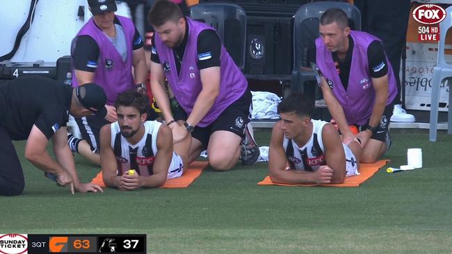 The Daicos brothers receiving treatment to start the fourth quarter. Credit: Fox Footy.