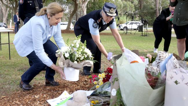 Queensland Premier Annastacia Palaszczuk and Police Commissioner Katarina Carroll lay flowers on the island on Tuesday. Picture: Steve Pohlner