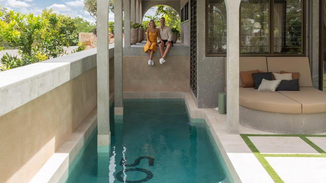 Graya co-founder Rob Gray and his wife, Meghan, overlooking the pool in their house. Photo: David Chatfield. Image supplied by Graya.