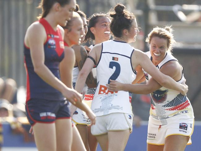 Crows players celebrate the Goal of the Year contender from Courtney Cramey (right), during their round seven AFLW match against Melbourne. PHOTO: AAP Image/Daniel Pockett