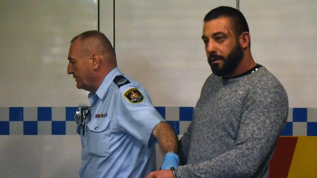 Ricardo Barbaro is escorted to a prison van after his arrest. Picture: AAP Image/Joel Carrett