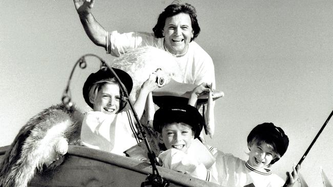 1994: Normie Rowe with Scott, Luke and Kane Fry at Fisherman’s Wharf in 1994. Picture: Richard Webb.