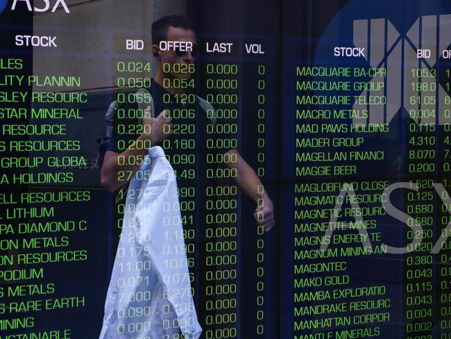 SYDNEY, AUSTRALIA - NewsWire Photos - APRIL 17 2023 -A general view of a person walking past the  Australian Stock Exchange at the ASX in central Sydney. Picture NCA NewsWire / Gaye Gerard