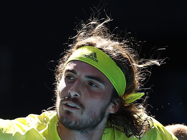 MELBOURNE, AUSTRALIA - FEBRUARY 13: Stefanos Tsitsipas of Greece plays a backhand in his Men's Singles third round match against Mikael Ymer of Sweden during day six of the 2021 Australian Open at Melbourne Park on February 13, 2021 in Melbourne, Australia. (Photo by Matt King/Getty Images)