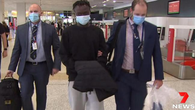 Mathiang Malok being taken through Melbourne Airport on April 7. Picture: 7NEWS