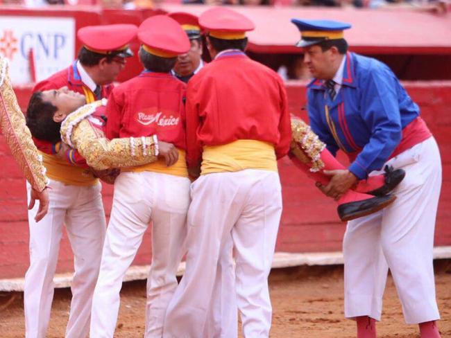 Matador Antonio Romero is carried from the ring after being gored.