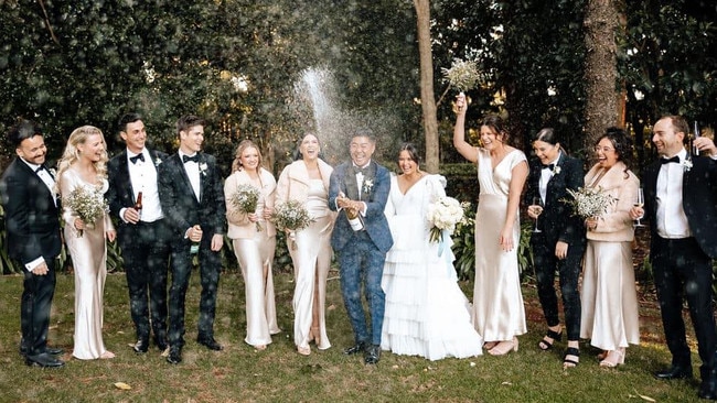 Corinne and Anthony Wong (middle) on their wedding day. Picture: via Facebook