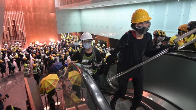 Protesters break into the government headquarters in Hong Kong. Picture: AFP