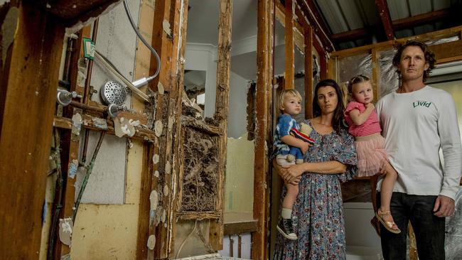 A Gold Coast couple bought a house in Elanora but later found out it was largely infested by termites and likely needs to be demolished. The couple, Sera and Shaun Sarson, now have to rent a house nearby for the safety of themselves and their children Aisla, 3, and Rio, 2, pictured here in the bathroom where a nest was found. Picture: Jerad Williams