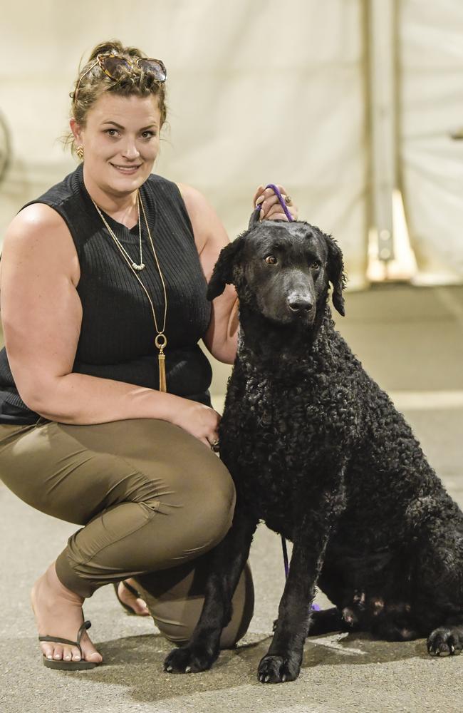 Teegan Hinks with curly coated retriever Hugo. Picture: Roy VanDerVegt