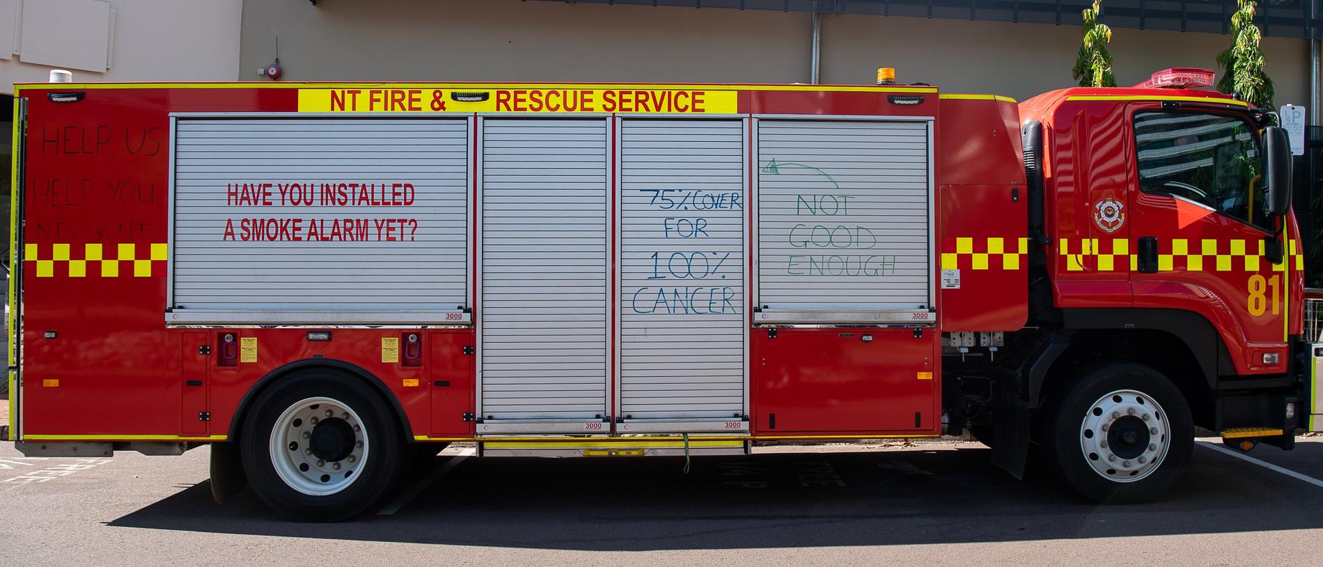 Firefighters have written slogans on their trucks calling on the NT government to step up in their pay negotiation with the United Workers Union. Picture: Pema Tamang Pakhrin