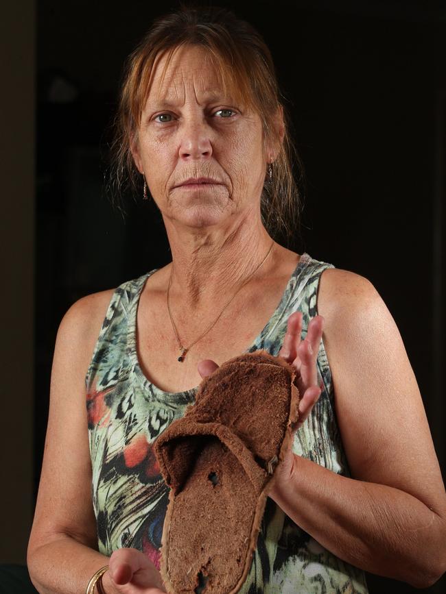 Sheryl Keen with a slipper believed to have come from the doomed flight. Picture: Ross Swanborough