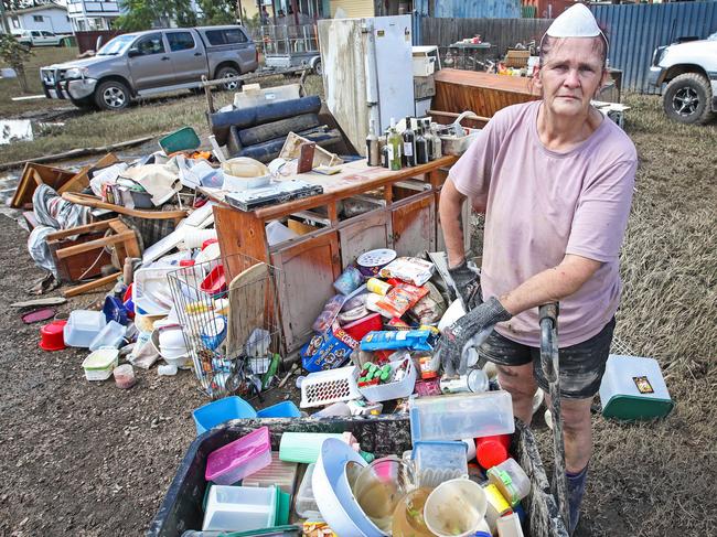 Judy Sinclair out the front of her Woogaroo Street home in Goodna which was severely flooded. Picture: Zak Simmonds