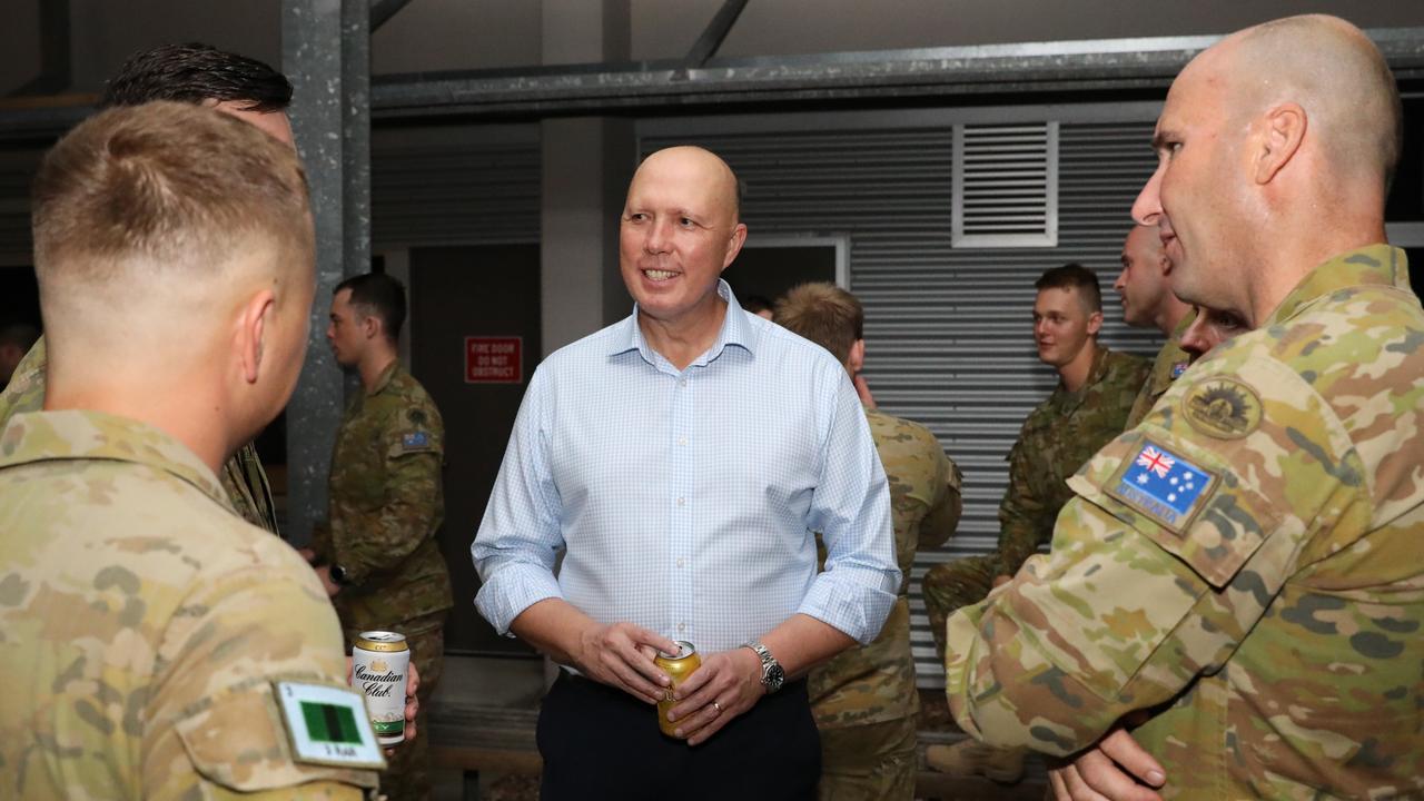 Defence Minister Peter Dutton speaks with military personnel at Lavarack Barracks in Townsville. Picture: Max Bree