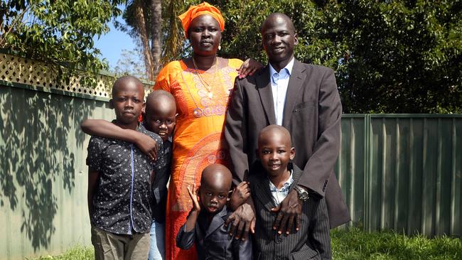 Majok Tulba with his wife Mary and their four children at their western Sydney home yesterday. Picture: James Croucher