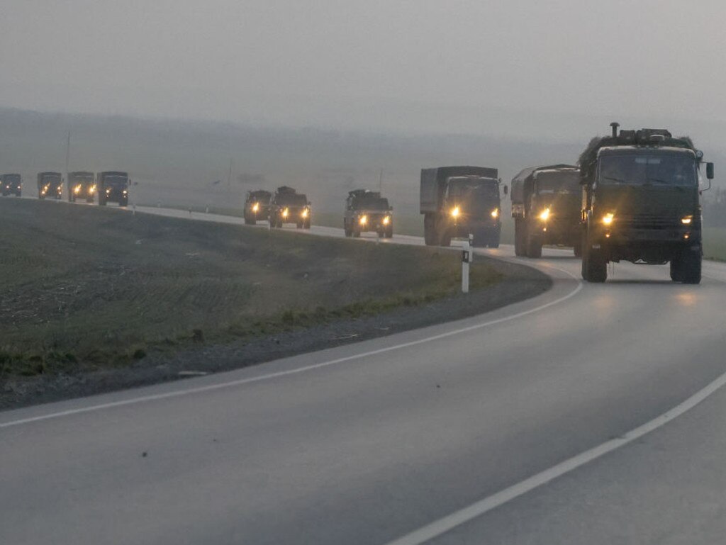 A convoy of Russian military vehicles is seen as the vehicles move towards border in Donbas region of eastern Ukraine on February 23, a day before bomb blasts in Kyiv.