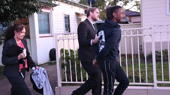 The teenager got a rude awakening in the form of the masked Raptor Squad officers who burst through the door of his family’s Auburn weatherboard home at dawn on Tuesday. Picture: Jeremy Piper