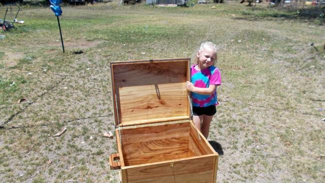 RAFFLE WINNER: Zo Edgley with her new camphor laurel blanket box. Picture: Mitchell Men's Shed