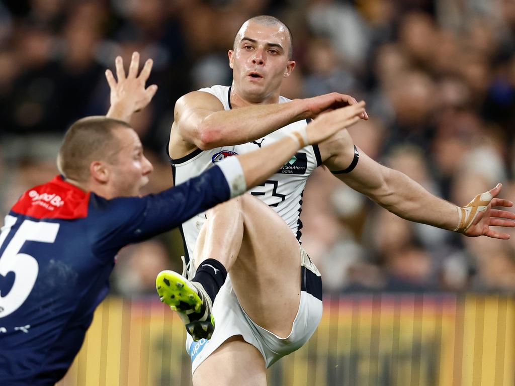 Melbourne, Australia. 02nd June, 2023. Alex Cincotta of Carlton tackles  Kysaiah Pickett of Melbourne during the AFL Round 12 match between the  Melbourne Demons and the Carlton Blues at the Melbourne Cricket