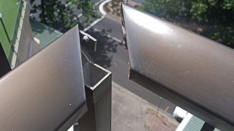 A woman staying in hotel quarantine claimed a balcony rail was unsafe after she leaned on it and came apart. Queensland Police have charged a woman with wilful damage.