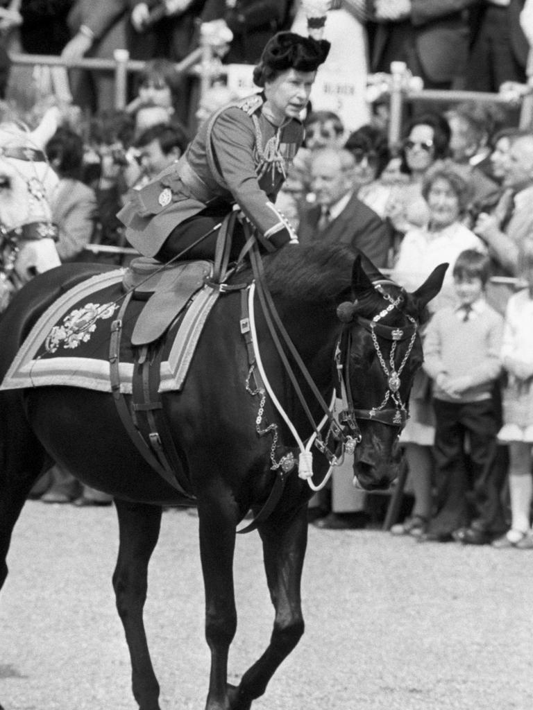 The Queen leans forward to reassure her horse Burmese as she enters Horseguards Parade after the incident in The Mall. Picture: Getty Images