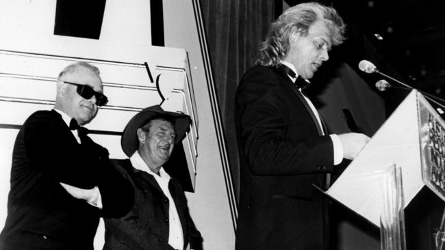 The power to be powerful: Elton John and Slim Dusty watch John Farnham blitz the first ARIAs in March 1987.