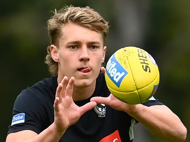 MELBOURNE, AUSTRALIA - APRIL 20: Finlay Macrae of the Magpies marks during a Collingwood Magpies AFL training session at the Holden Centre on April 20, 2021 in Melbourne, Australia. (Photo by Quinn Rooney/Getty Images)