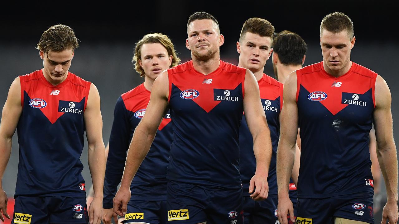 The Demons look dejected after losing to the Richmond Tigers. Picture: Quinn Rooney