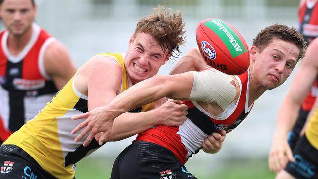 Ryan Byrnes tackles Jack Billings at St Kilda training. Picture: Michael Klein