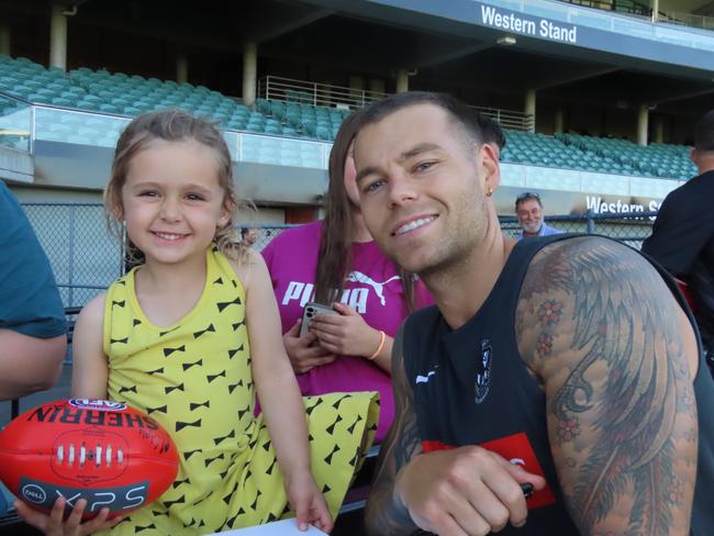 Collingwood player Jamie Elliott with Piper, four. Picture: Jon Tuxworth